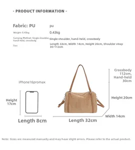 Detail view of retro brown PU leather tote with size dimensions and phone comparison