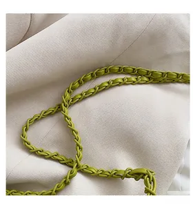 Detail of lime green woven leather chain strap with premium quilted texture and finish