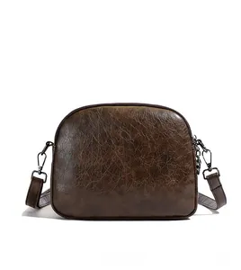 Detailed back view of a dark brown vintage faux leather shoulder bag with smooth zippers