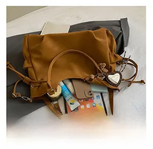Interior view of large capacity brown tote bag showing tablet, phone and cosmetics