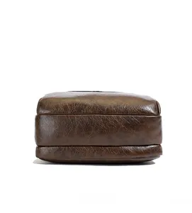 Detailed bottom view of deep brown leather bag showing premium stitching and texture