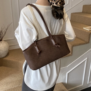 Dark brown textured shoulder bag with woven pattern and knot detail for women
