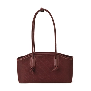 Burgundy woven leather underarm bag with knot detail and long shoulder straps