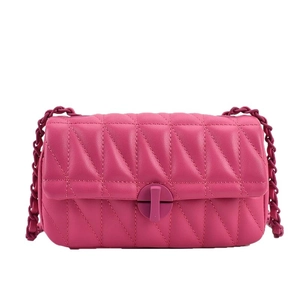 Chic pink quilted shoulder bag with V-stitch pattern and chain strap on white background