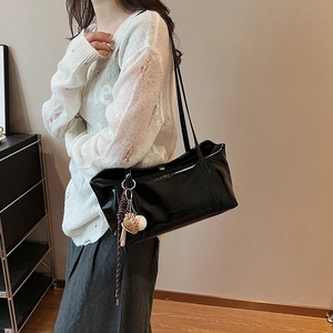 Retro black glossy tote bag with large capacity and unique baseball charm accessory