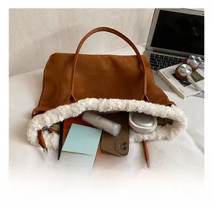 Brown suede tote bag showing spacious interior with tablet, phone and makeup items