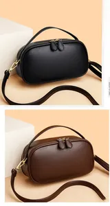 Dual view of black and brown leather crossbody bags with top handles and zippers