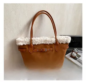 Brown suede tote bag with white faux shearling trim and laptop for commuting lifestyle