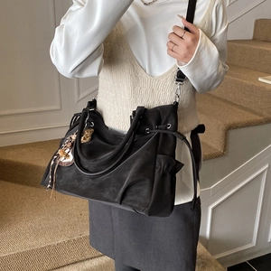 Minimalist black large capacity tote bag with drawstring and leopard print charm