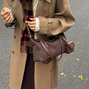 Minimalist large brown tote bag with mini pendant crossbody strap on stylish model