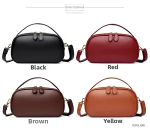 Macro shot of pebble grain leather handbags in black, red, brown, and yellow with gold zippers