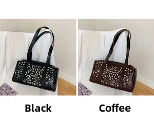 Detail view of vintage tote bags in black and coffee brown with studded metal accents