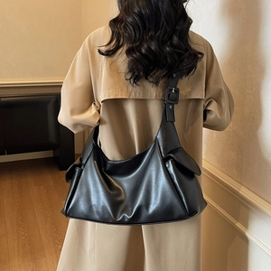 Classic black oversized hobo bag in faux leather with adjustable strap for women