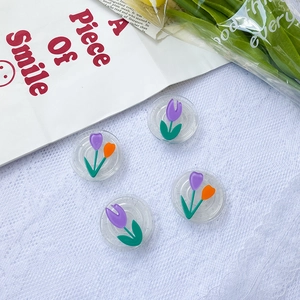 Flat glitter flower collapsible phone grip sockets with purple tulip designs on blue background