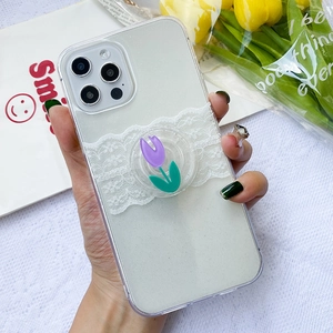 Close-up of clear glitter iPhone case featuring white lace and purple tulip phone socket