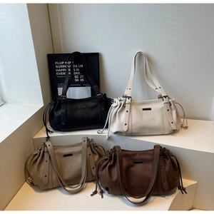 Group shot of stylish textured leather tote bags in four neutral autumn-winter colors