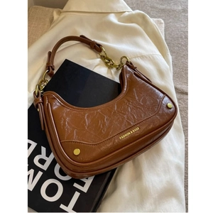Brown vintage crescent underarm bag with pleated texture and metallic chain strap