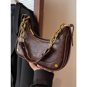 Dark brown crescent shoulder bag with gold chain and crinkled oil wax leather texture