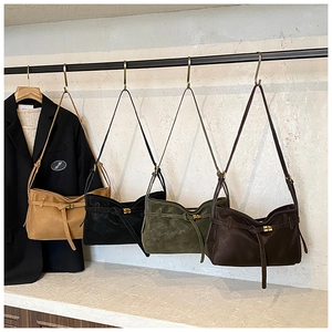 Detail view of retro matte leather tote bags in brown, black, green and coffee colors