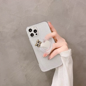 Clear glitter phone case with silver heart mirror stand and gold bear charms for iPhone