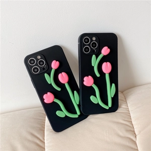 Detail of 3D pink tulip floral relief on black matte silicone case for iPhone 16
