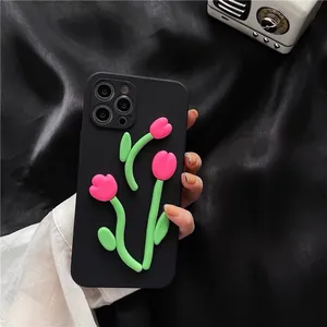 Detailed view of black matte iPhone case featuring 3D pink tulip floral relief design