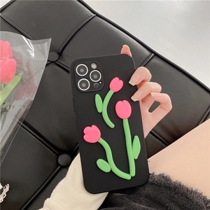 Detail showing 3D pink tulip flowers on matte black protective case for iPhone