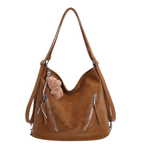 Brown large capacity PU leather hobo tote bag with metal zippers and plush bear charm