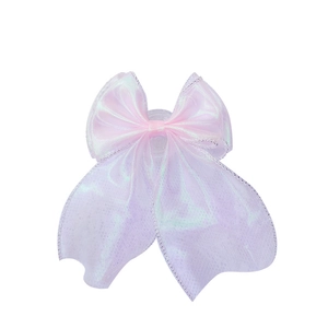 Iridescent pink lace bow phone grip with holographic laser effect on a white background
