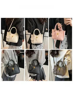 Litchi pattern bucket bag shown in multiple colors with dog charm and gold twist lock