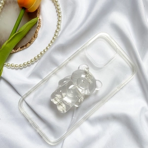 Détail du support de téléphone ours 3D transparent avec remplissage de grains blancs