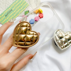 Detail of heart-shaped phone socket with electroplated grid pattern and floral chain