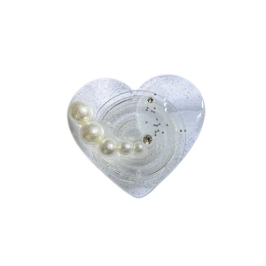 Glittery heart phone grip with pearls and rhinestones on a clean white background