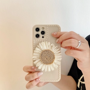 Macro detail of creamy silicone phone case with 3D daisy flower and heart embossed edges