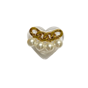 Heart-shaped phone grip with gold chain and pearls on transparent resin base