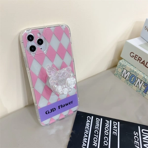 Pink argyle iPhone case with 3D butterfly, pearls and floral foldable phone grip