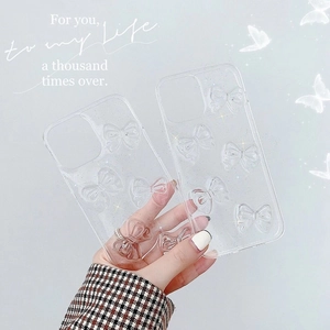 Clear glitter iPhone 16 Pro Max case featuring 3D bow designs and glossy finish