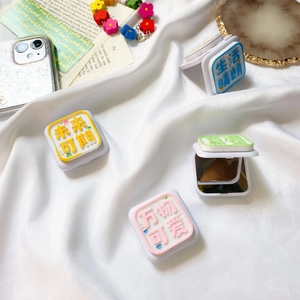 Detail of portable foldable phone mirrors with colorful 3D embossed floral patterns