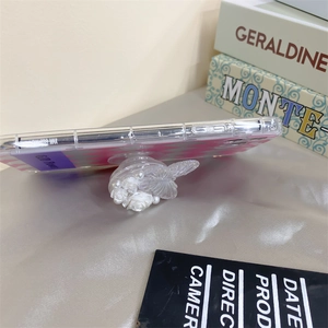 Side view of foldable phone grip with 3D resin flower and butterfly on translucent case
