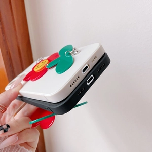 Detailed view of the charging port and speaker holes of the sunflower iPhone case