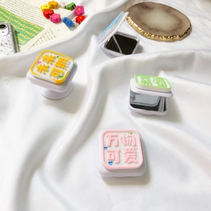 Detail of multi-functional phone socket stand with 3D text and built-in vanity mirror