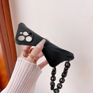 Close-up showing the flexible black TPU case material with heart chain for iPhone 12