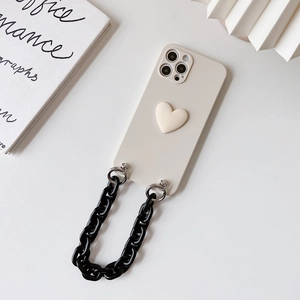 Detail of cream beige iPhone case with 3D heart and glossy black chain strap