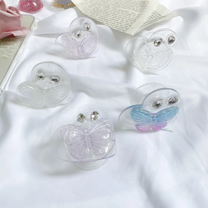 Five heart-shaped butterfly phone grips with rhinestones in clear and gradient colors