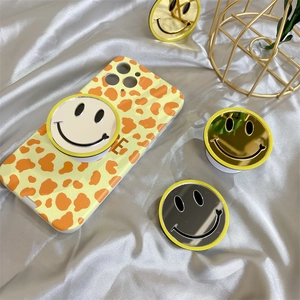 Yellow leopard print phone case with three retractable smiley face mirror sockets