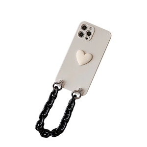 Cream iPhone case with 3D heart design and black acrylic chain strap on white background