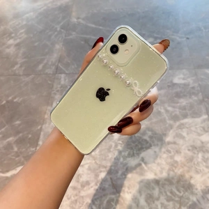 Sparkly mint green iPhone case with elegant pearl handle and bow for iPhone 16 Pro Max