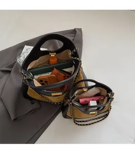 Internal view showing storage capacity of contrast leather quilted crossbody bags
