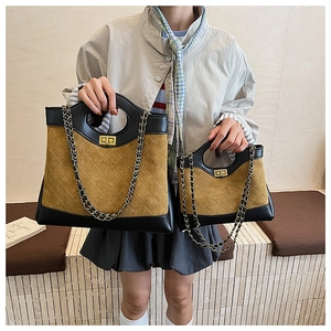 Detail showing contrast quilted mustard suede handbag sizes with gold chain strap