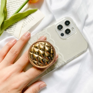 Foldable golden grid phone grip stand on glitter case with elegant tulip background